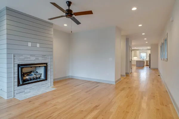 a view of a room window and wooden floor