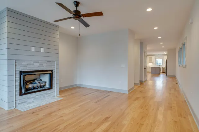 a view of a room window and wooden floor