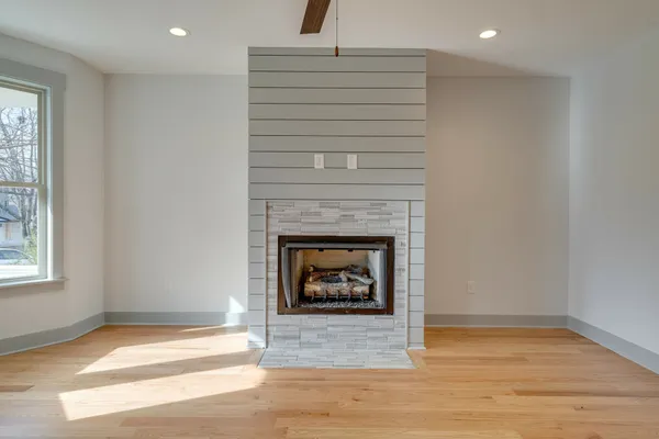a living room with a fireplace and a fireplace