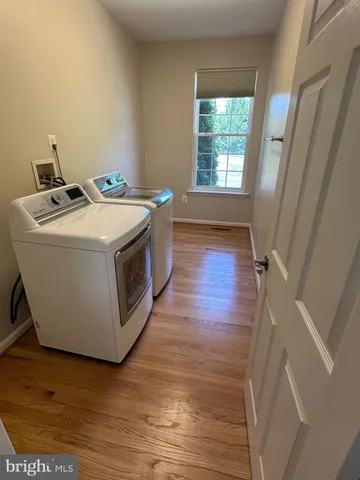 a view of a balcony with wooden floor