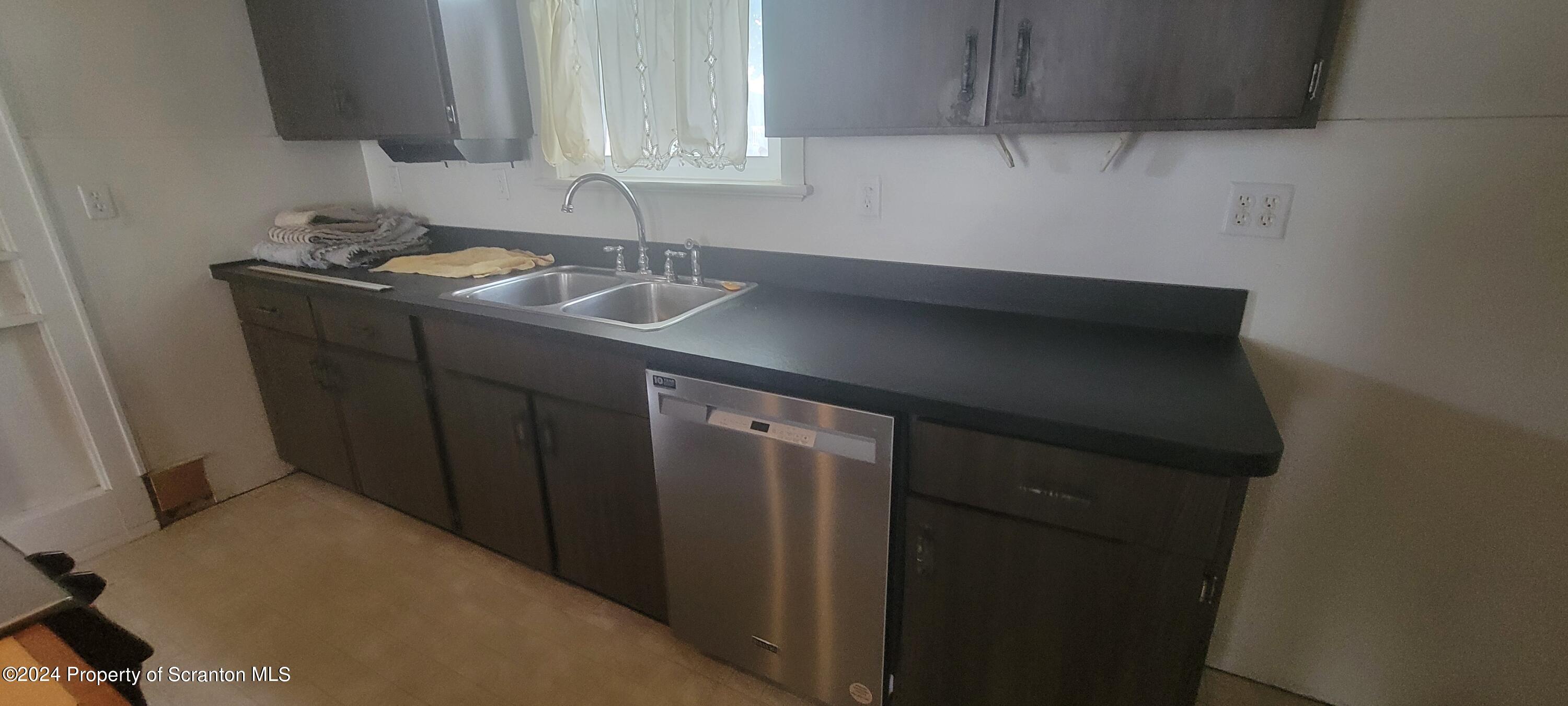 1543 Capouse Avenue Scranton, PA 18509 - Photo 21 of 62 a kitchen with a sink and cabinets