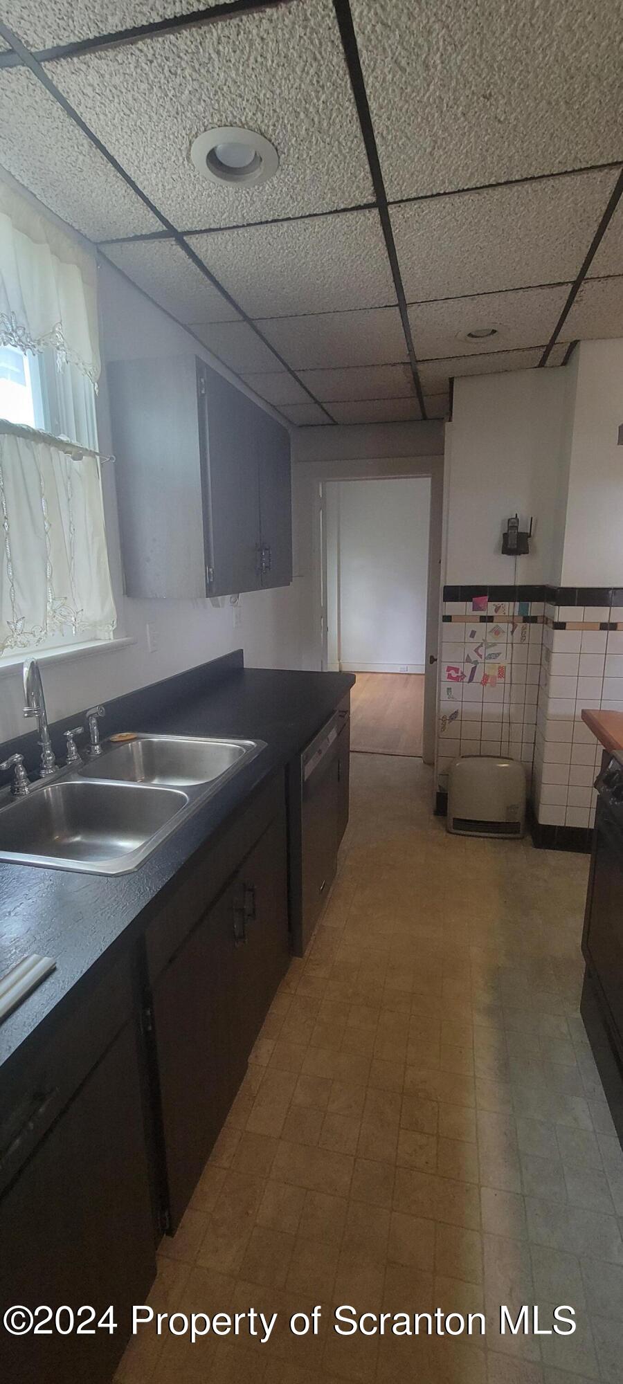 1543 Capouse Avenue Scranton, PA 18509 - Photo 22 of 62 a kitchen with a sink and cabinets