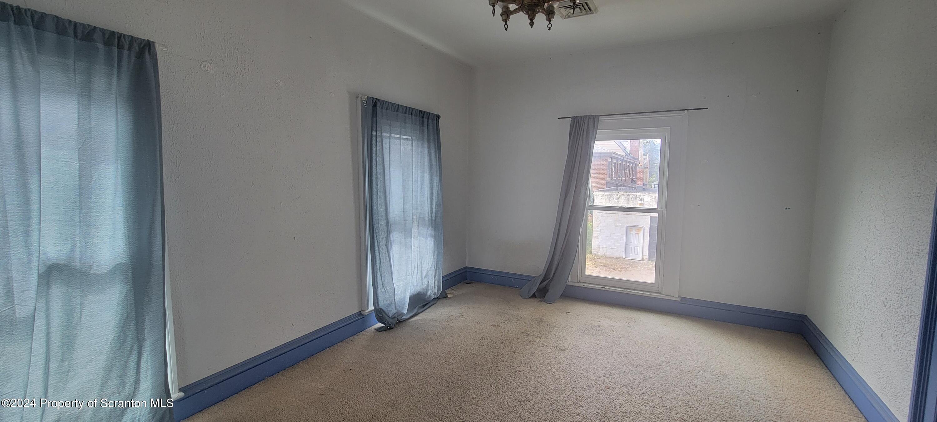 1543 Capouse Avenue Scranton, PA 18509 - Photo 30 of 62 a view of an empty room and a window