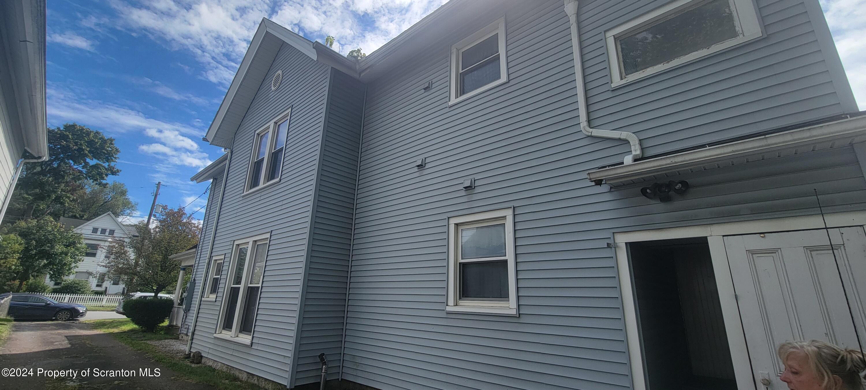 1543 Capouse Avenue Scranton, PA 18509 - Photo 4 of 62 a view of a house with a yard