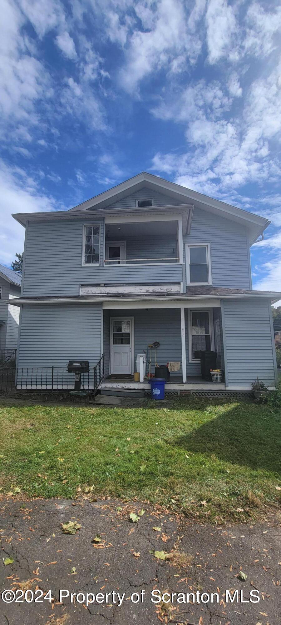 1543 Capouse Avenue Scranton, PA 18509 - Photo 5 of 62 a view of a building with a yard