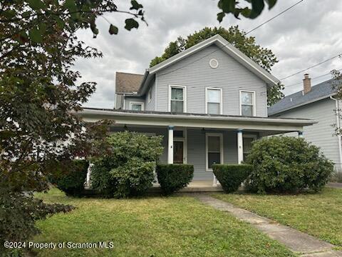1543 Capouse Avenue Scranton, PA 18509 - Photo 61 of 62 a front view of a house with a garden