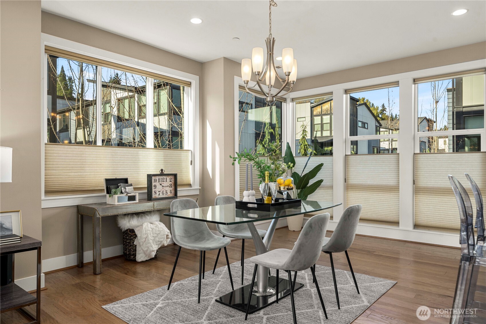 9710 Main Street, Unit A Bothell, WA 98011 - Photo 4 of 7 a view of a dining room with furniture large windows and wooden floor