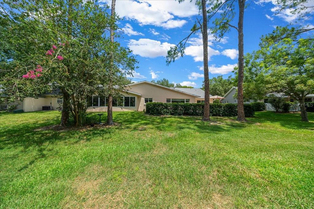 8720 Southwest 90th Street, Unit A Ocala, FL 34481 - Photo 47 of 71 a front view of a house with yard and green space
