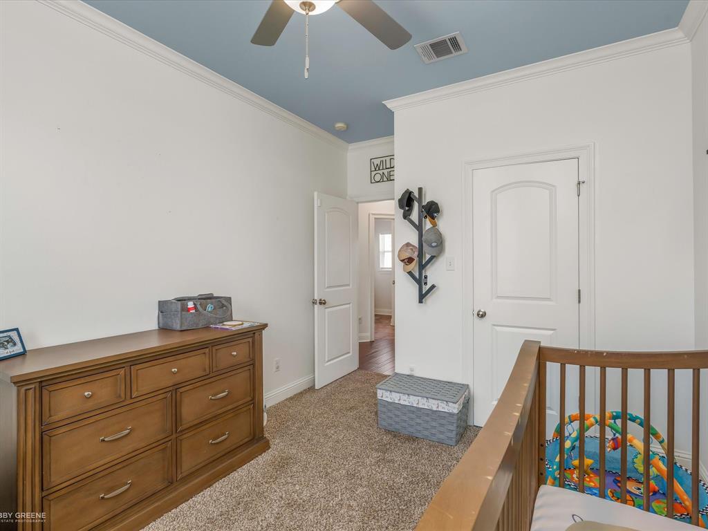 690 Lessie Drive Stonewall, LA 71078 - Photo 24 of 29 Light-filled interior space featuring a ceiling fan, crown molding, and carpeting