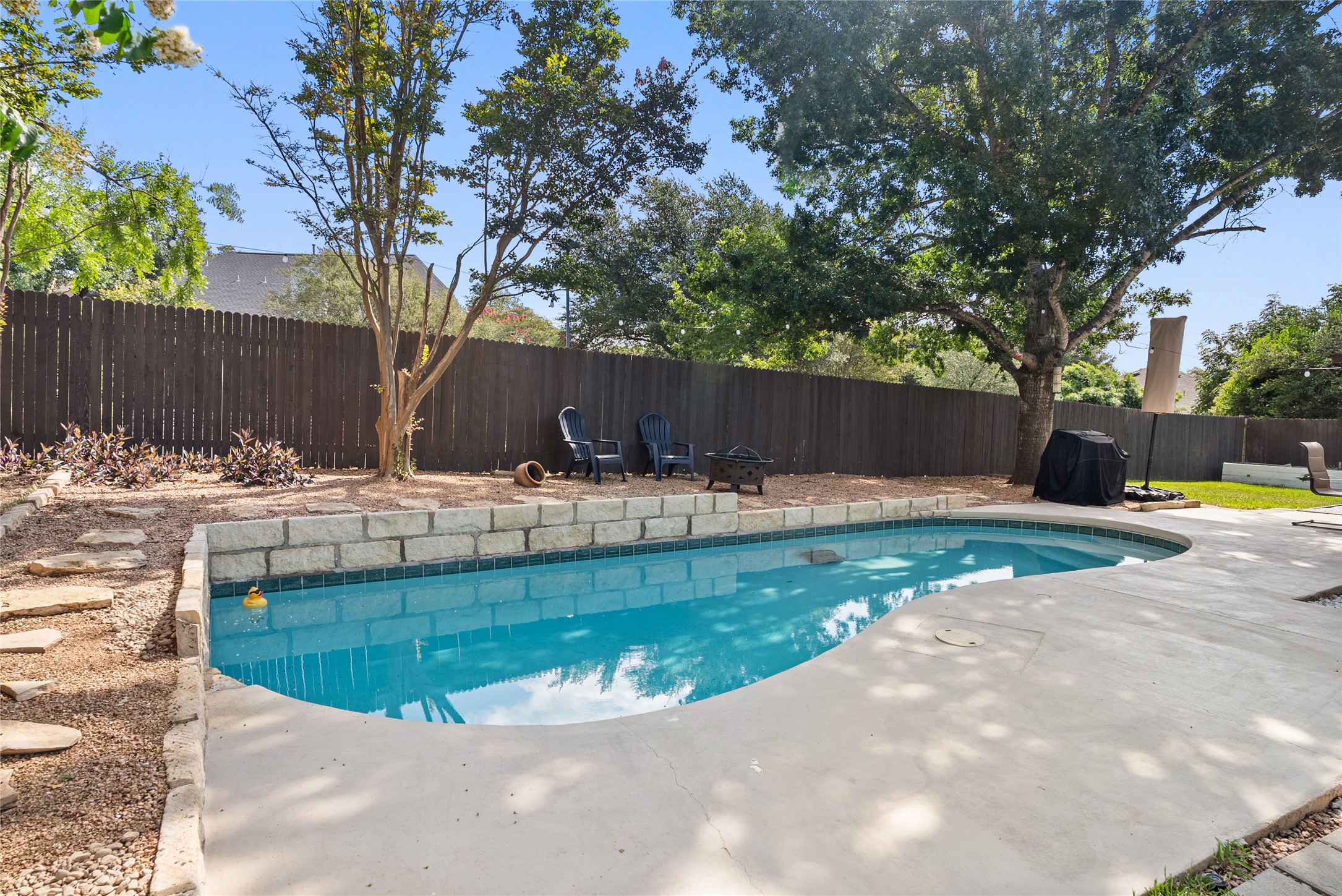 9024 Heiden Lane Austin, TX 78749 - Photo 31 of 33 The spacious deck area surrounding the pool provides plenty of room for lounge chairs, soaking up the sun, or watching outdoor activities.