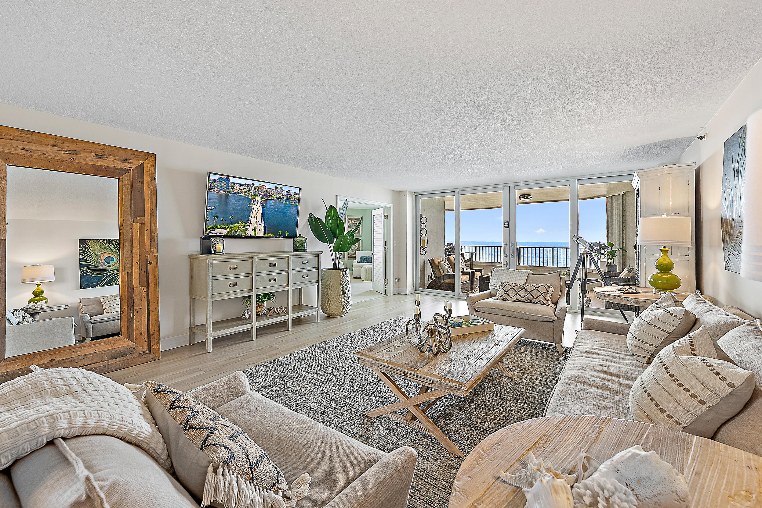 5200 North Ocean Drive, Unit 505 Singer Island, FL 33404 - Photo 20 of 30 a living room with furniture couches and a dining table with kitchen view