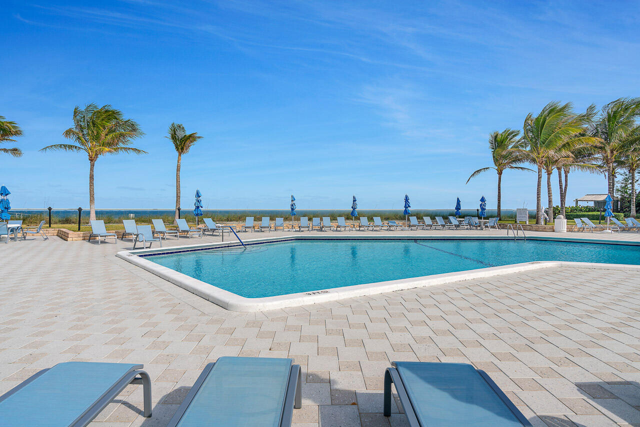 5200 North Ocean Drive, Unit 505 Singer Island, FL 33404 - Photo 25 of 30 a view of a swimming pool and an outdoor space