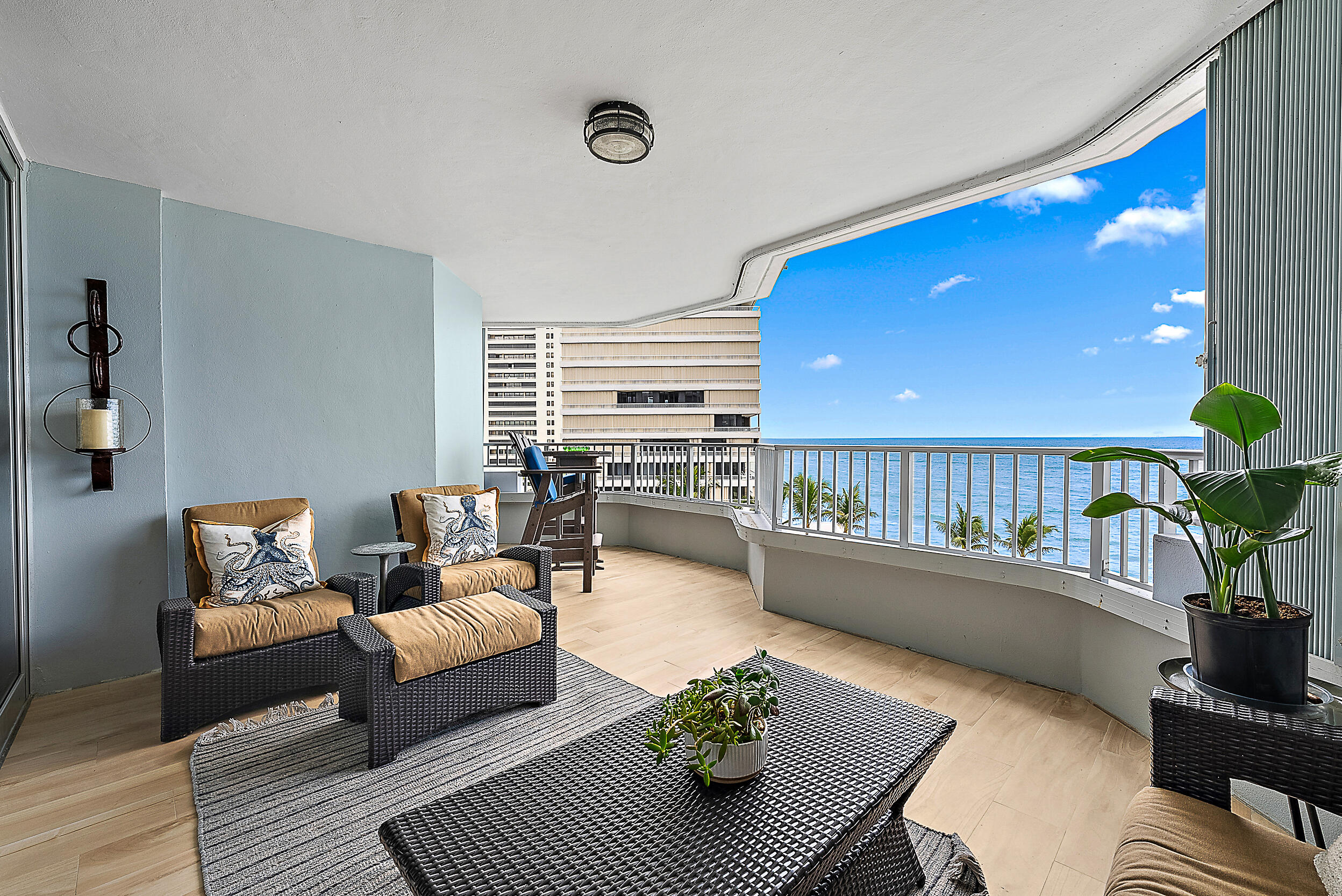 5200 North Ocean Drive, Unit 505 Singer Island, FL 33404 - Photo 3 of 30 a living room with furniture and a wooden floor