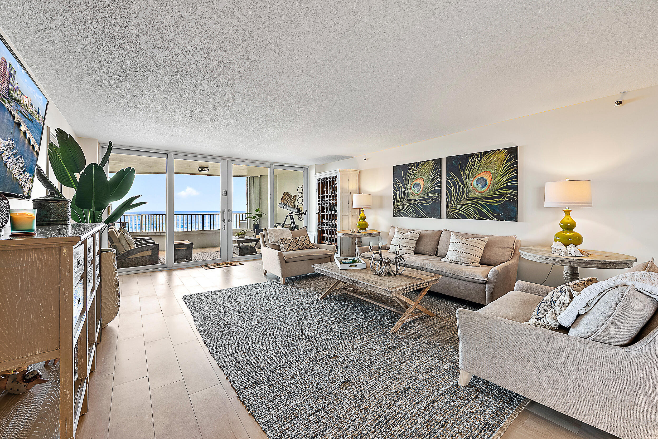 5200 North Ocean Drive, Unit 505 Singer Island, FL 33404 - Photo 5 of 30 a living room with furniture and a couch