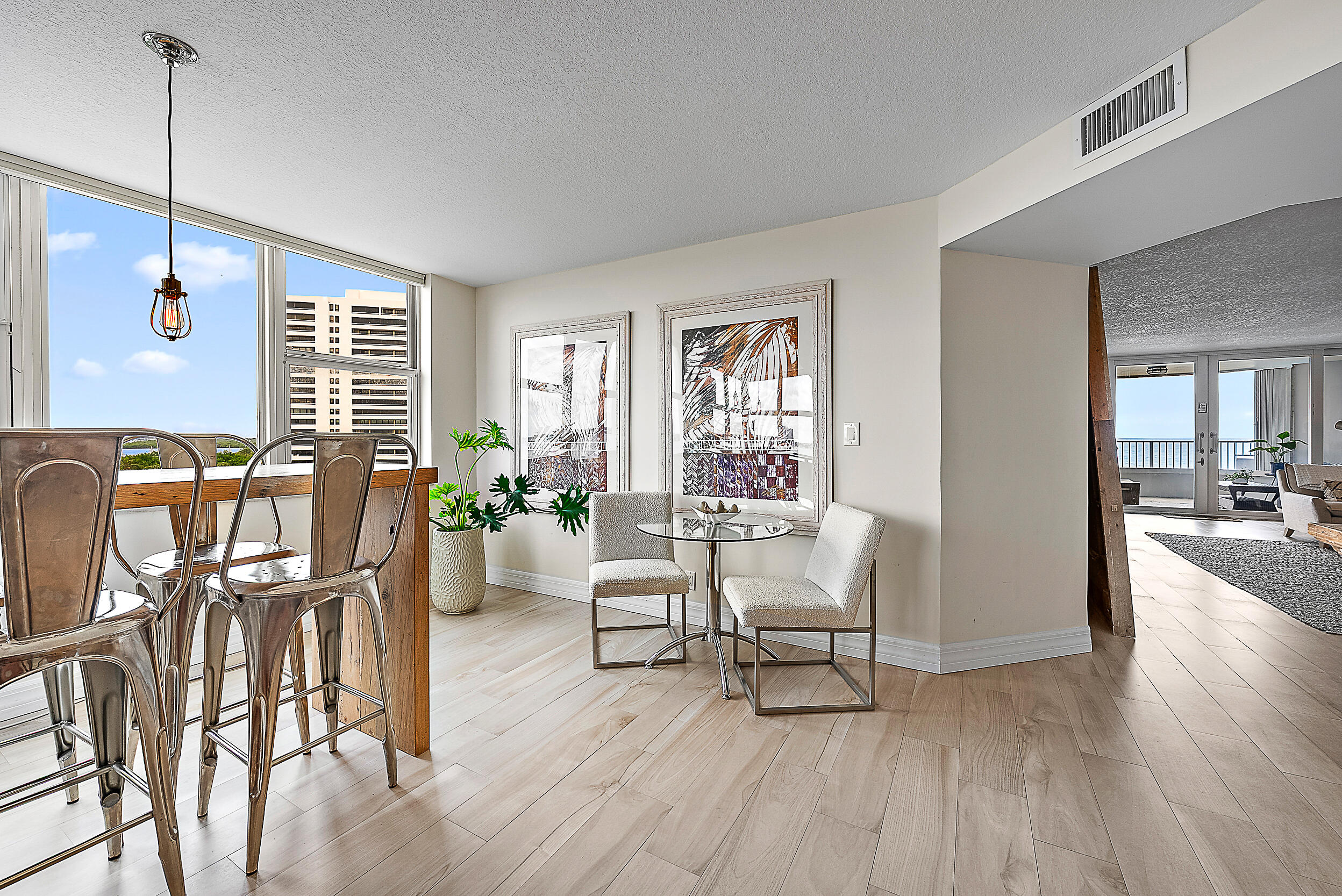 5200 North Ocean Drive, Unit 505 Singer Island, FL 33404 - Photo 9 of 30 a living room with furniture and wooden floor