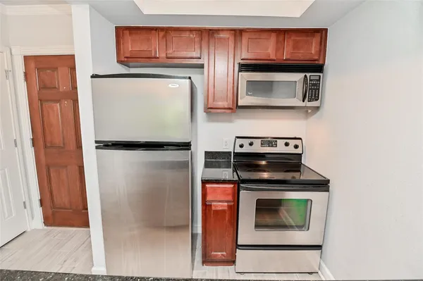 a kitchen with a stove and a microwave