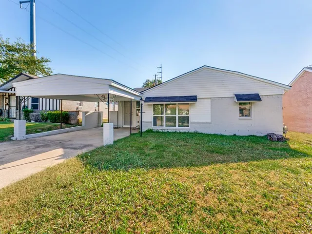 a view of a kitchen with a sink a refrigerator and a stove top oven