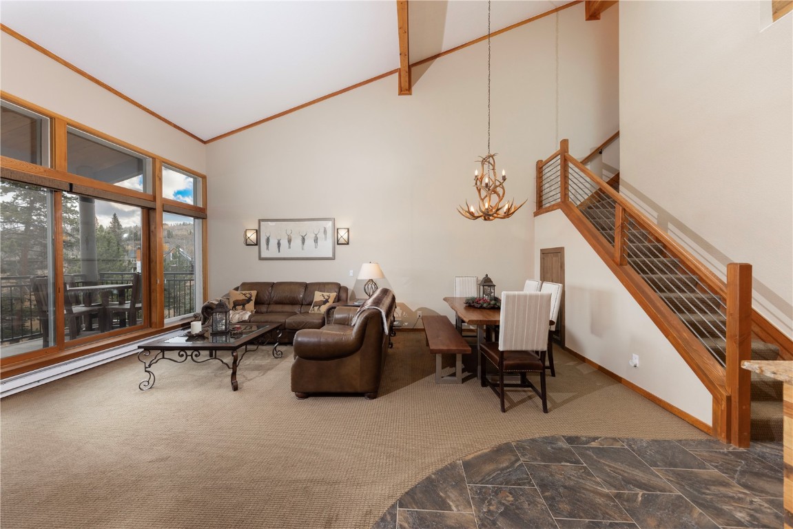 21630 Highway 6, Unit 2145 Keystone, CO 80435 - Photo 12 of 39 a living room with furniture gym equipment and a large window