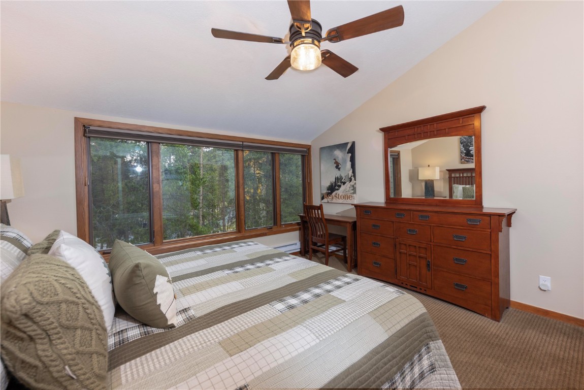21630 Highway 6, Unit 2145 Keystone, CO 80435 - Photo 17 of 39 a bedroom with a bed and a dresser
