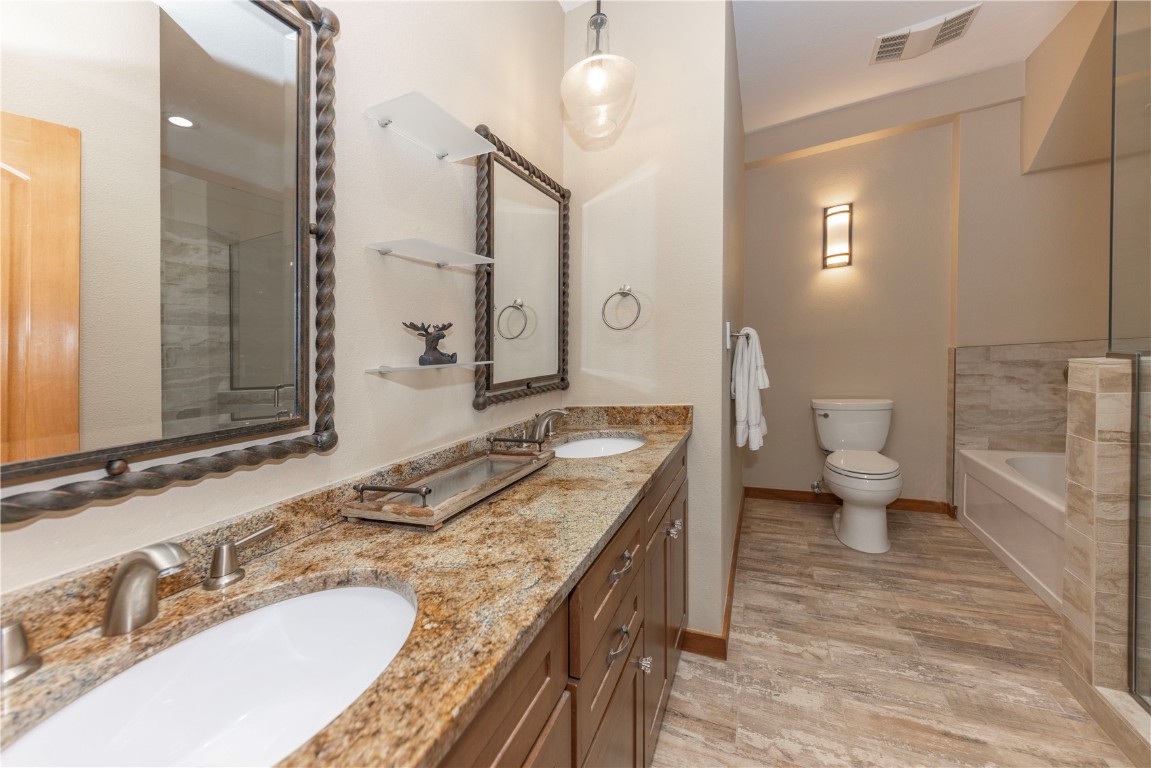 21630 Highway 6, Unit 2145 Keystone, CO 80435 - Photo 19 of 39 a bathroom with a granite countertop double vanity sink and a mirror