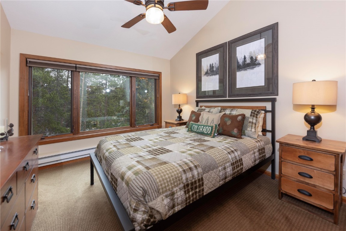21630 Highway 6, Unit 2145 Keystone, CO 80435 - Photo 22 of 39 a bedroom with a bed and a large window