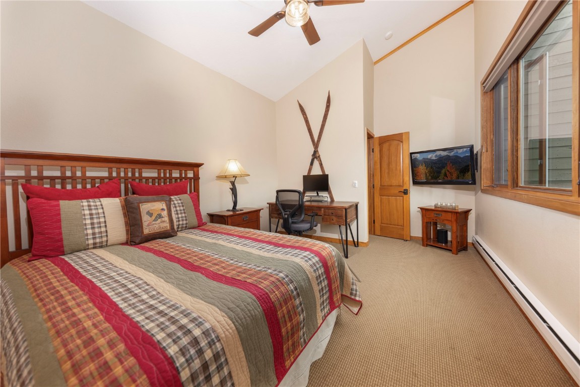 21630 Highway 6, Unit 2145 Keystone, CO 80435 - Photo 25 of 39 a bedroom with a bed and a large window