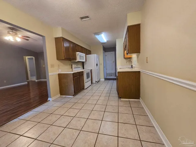 a kitchen with stainless steel appliances a sink and a counter top space