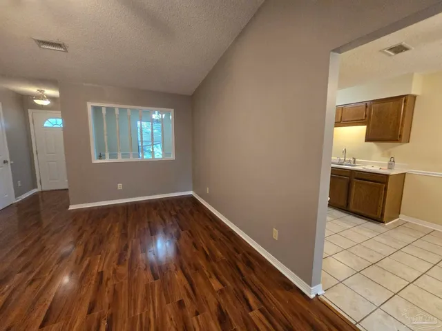 a view of a kitchen from the hallway