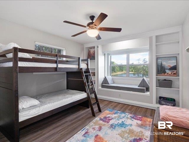 4650 Wiggins Lane Wilmer, AL 36587 - Photo 23 of 66 Bedroom with wood finished floors, multiple windows, and a ceiling fan