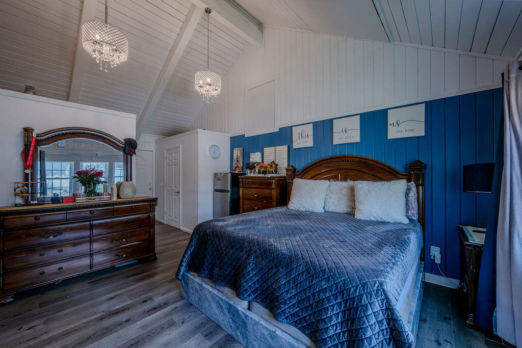 7 Ebenezer Road Osterville, MA 02655 - Photo 4 of 16 a bedroom with a bed and a dresser with mirror