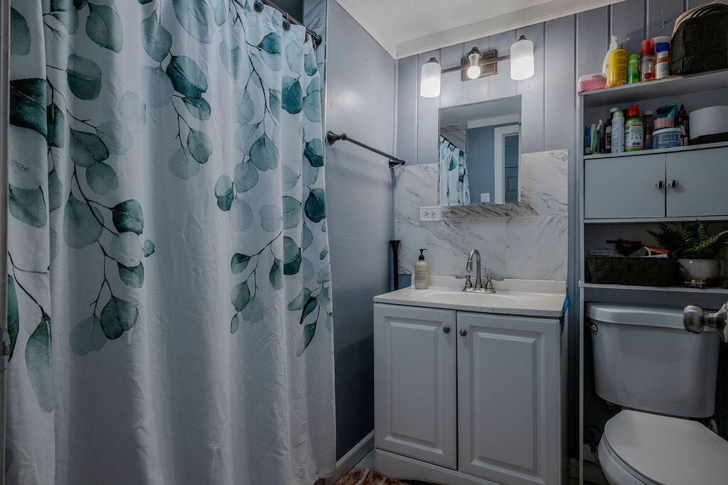 7 Ebenezer Road Osterville, MA 02655 - Photo 6 of 16 a bathroom with a sink toilet and vanity