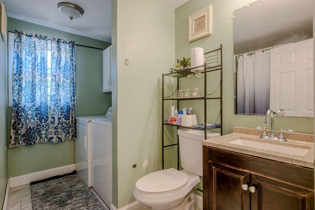 7 Ebenezer Road Osterville, MA 02655 - Photo 7 of 16 a bathroom with a sink a toilet and shower