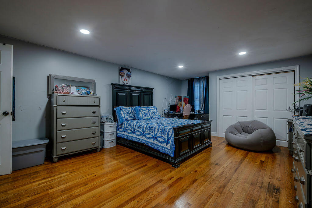 7 Ebenezer Road Osterville, MA 02655 - Photo 8 of 16 a bedroom with furniture and a wooden floor