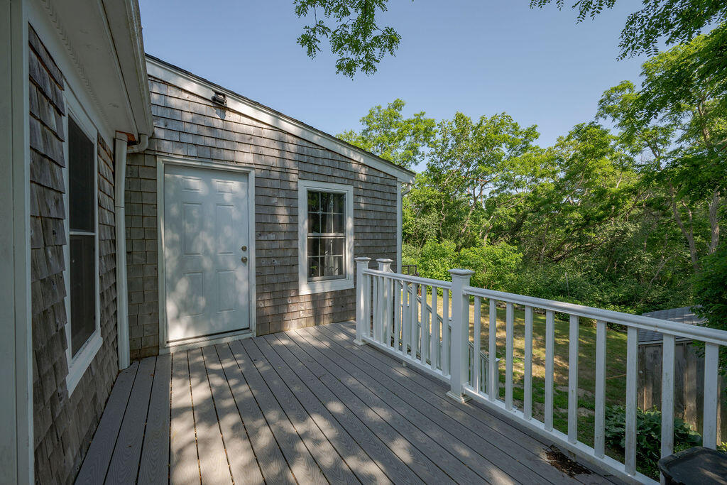 7 Ebenezer Road Osterville, MA 02655 - Photo 9 of 16 a view of a house with a balcony