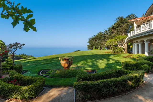 a view of a dining room with furniture a chandelier and wooden floor