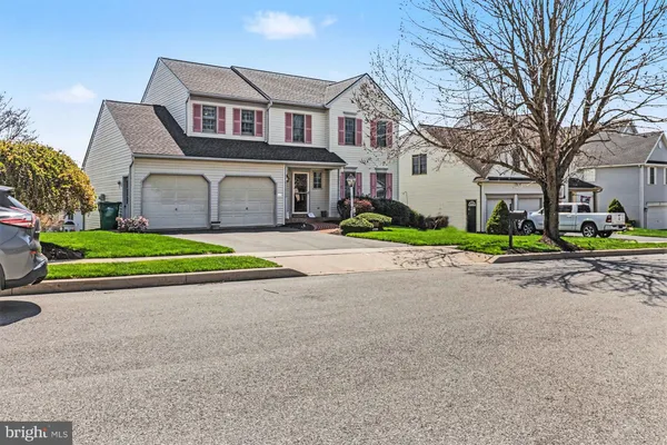 a view of a patio with couches and table and chairs and potted plants