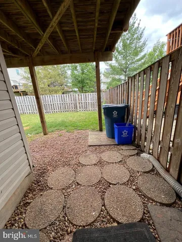 a view of porch with wooden floor