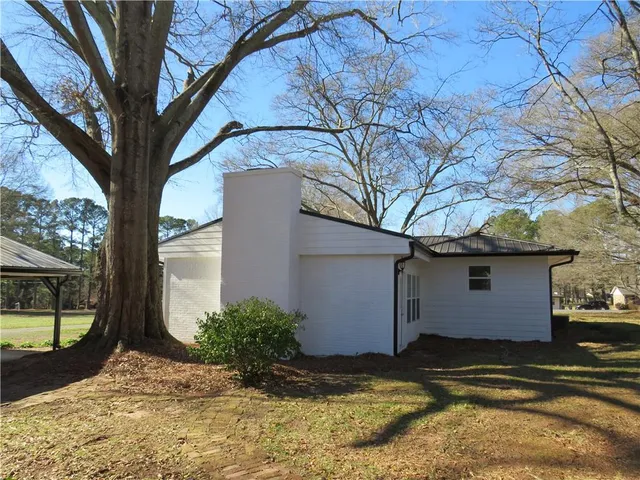 a view of a backyard of a house