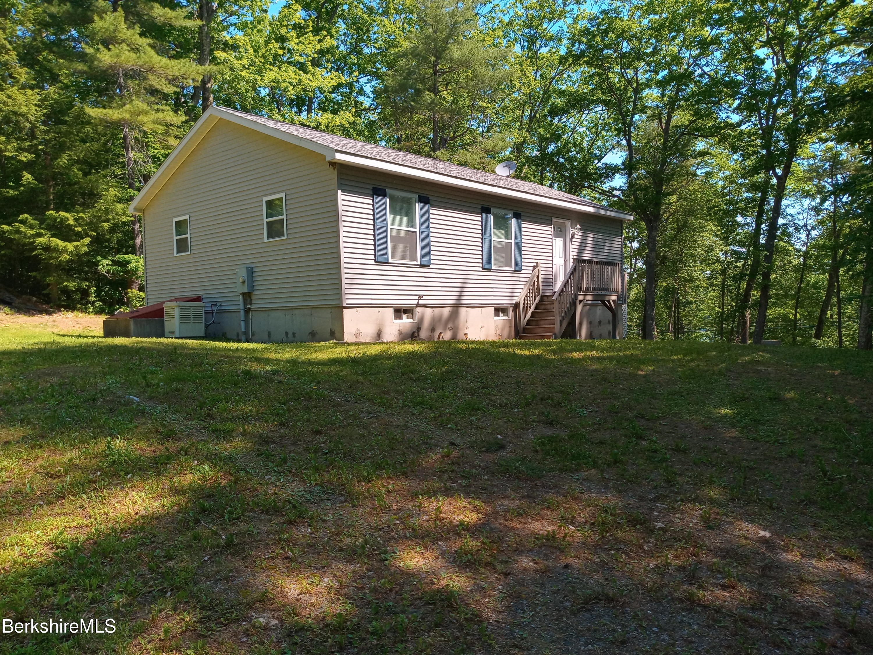 42 Norton Road Otis, MA 01029 - Photo 1 of 35 a front view of house with yard and green space