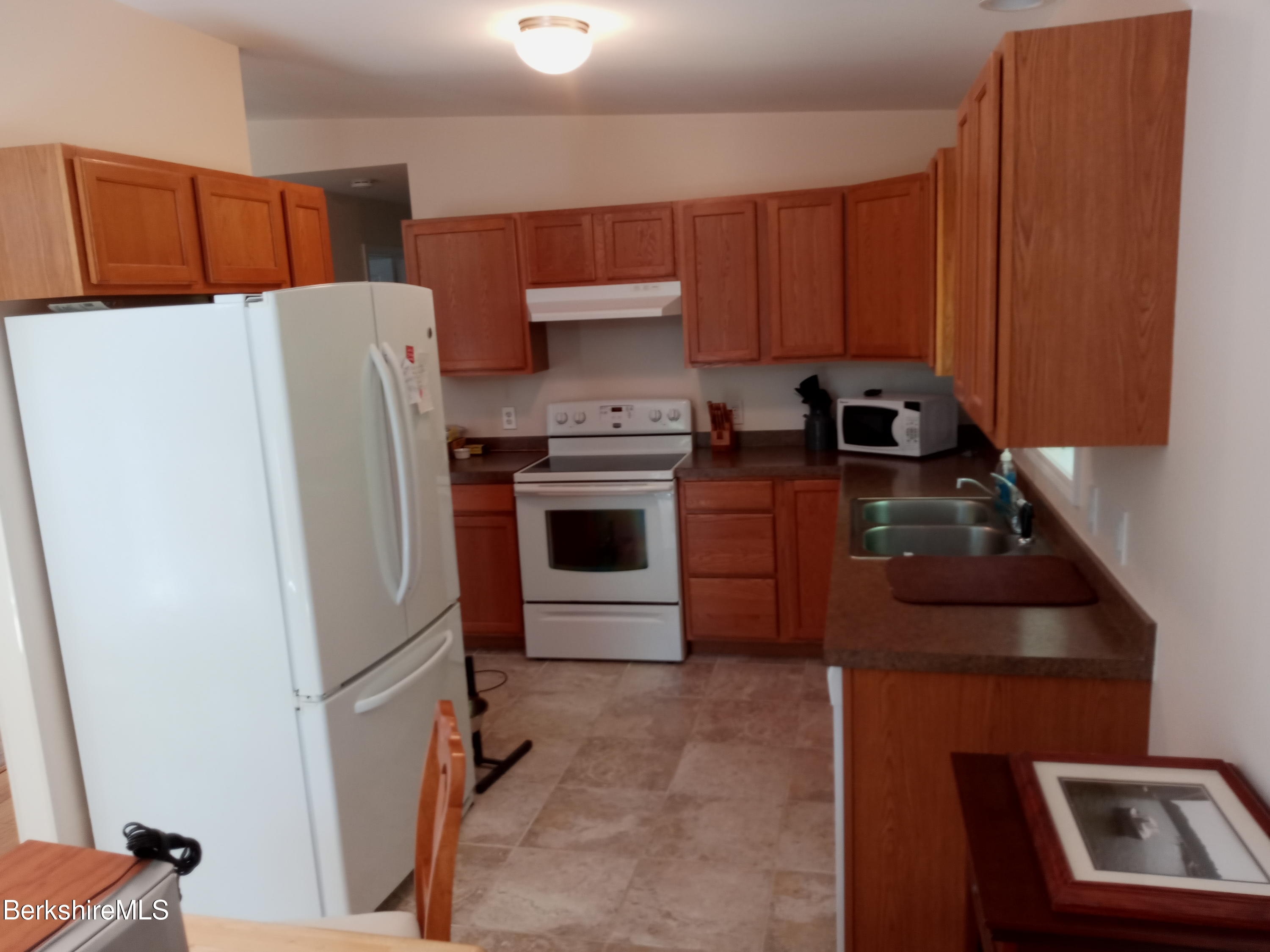 42 Norton Road Otis, MA 01029 - Photo 11 of 35 a kitchen with a refrigerator sink and stove