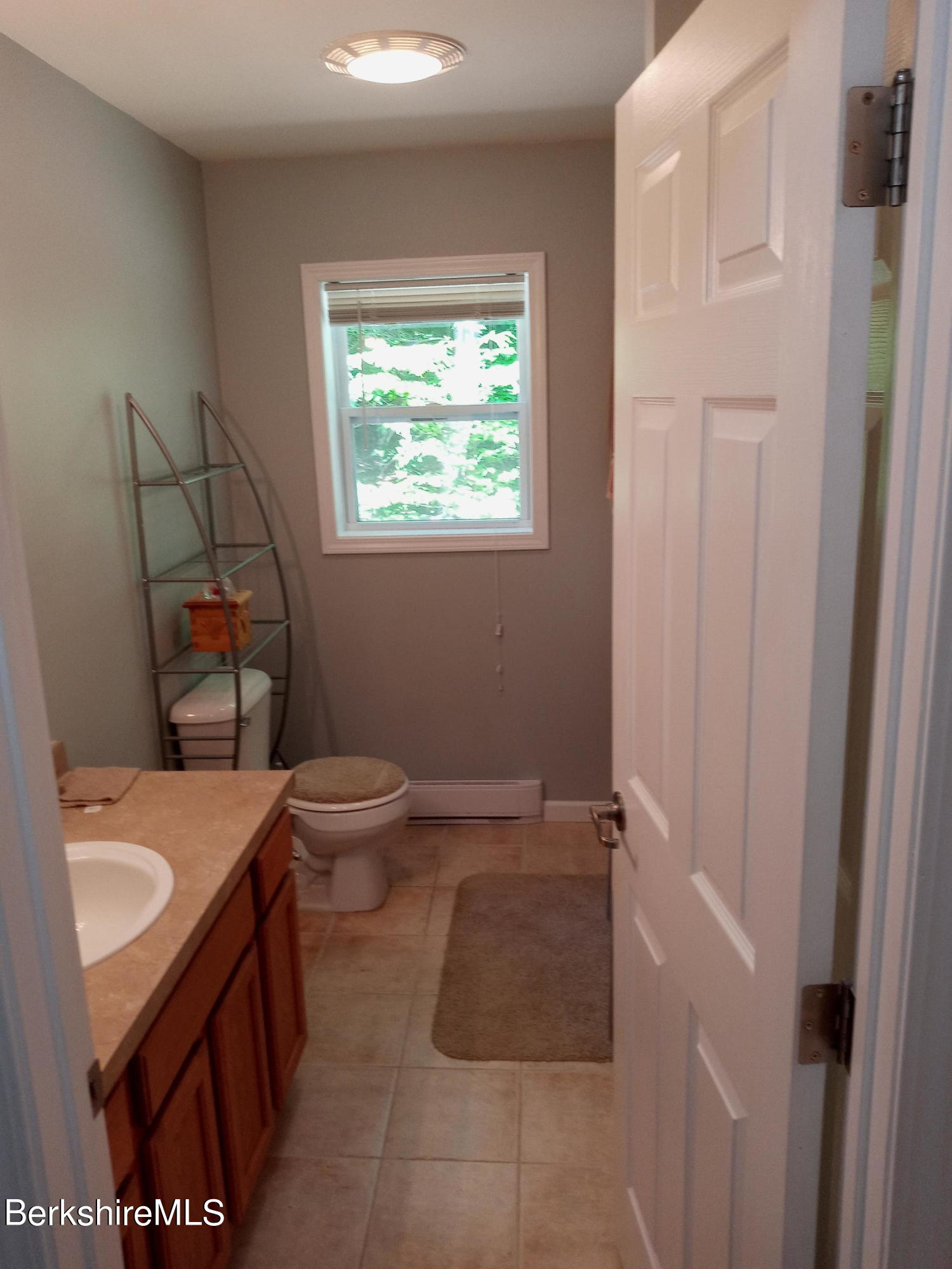 42 Norton Road Otis, MA 01029 - Photo 15 of 35 a bathroom with a sink toilet and window