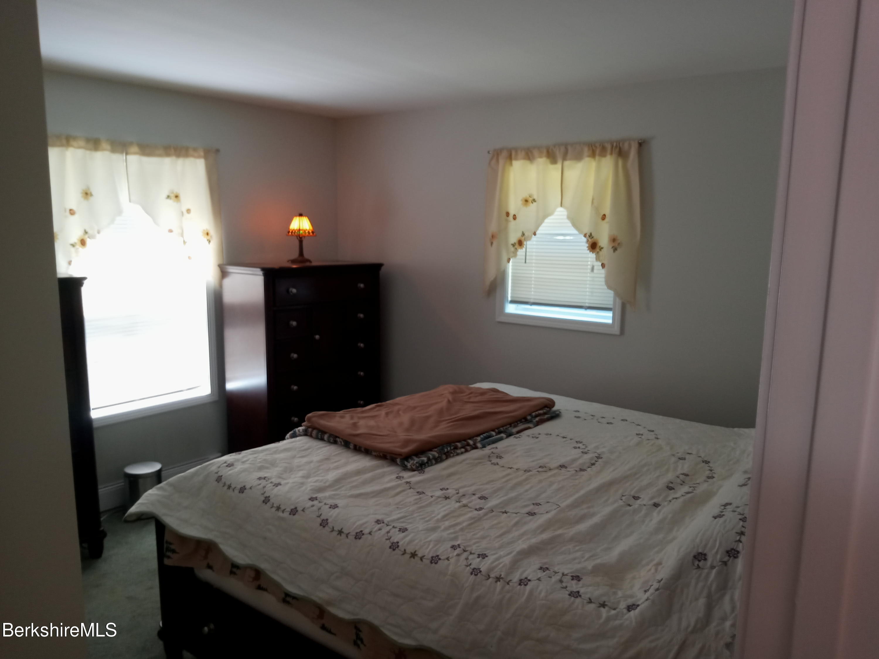 42 Norton Road Otis, MA 01029 - Photo 17 of 35 a bedroom with a bed and a window