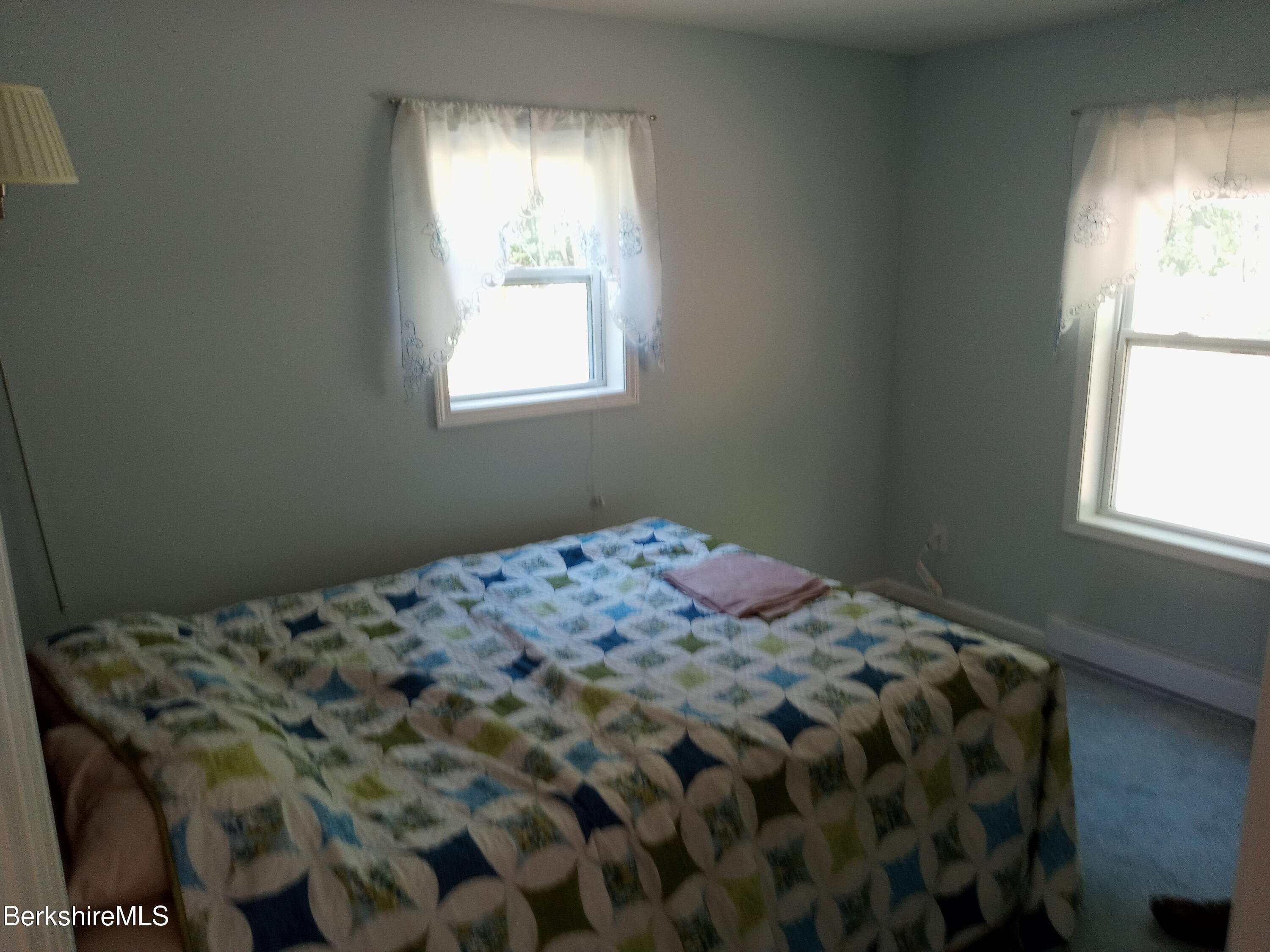 42 Norton Road Otis, MA 01029 - Photo 19 of 35 a bedroom with a bed and a window