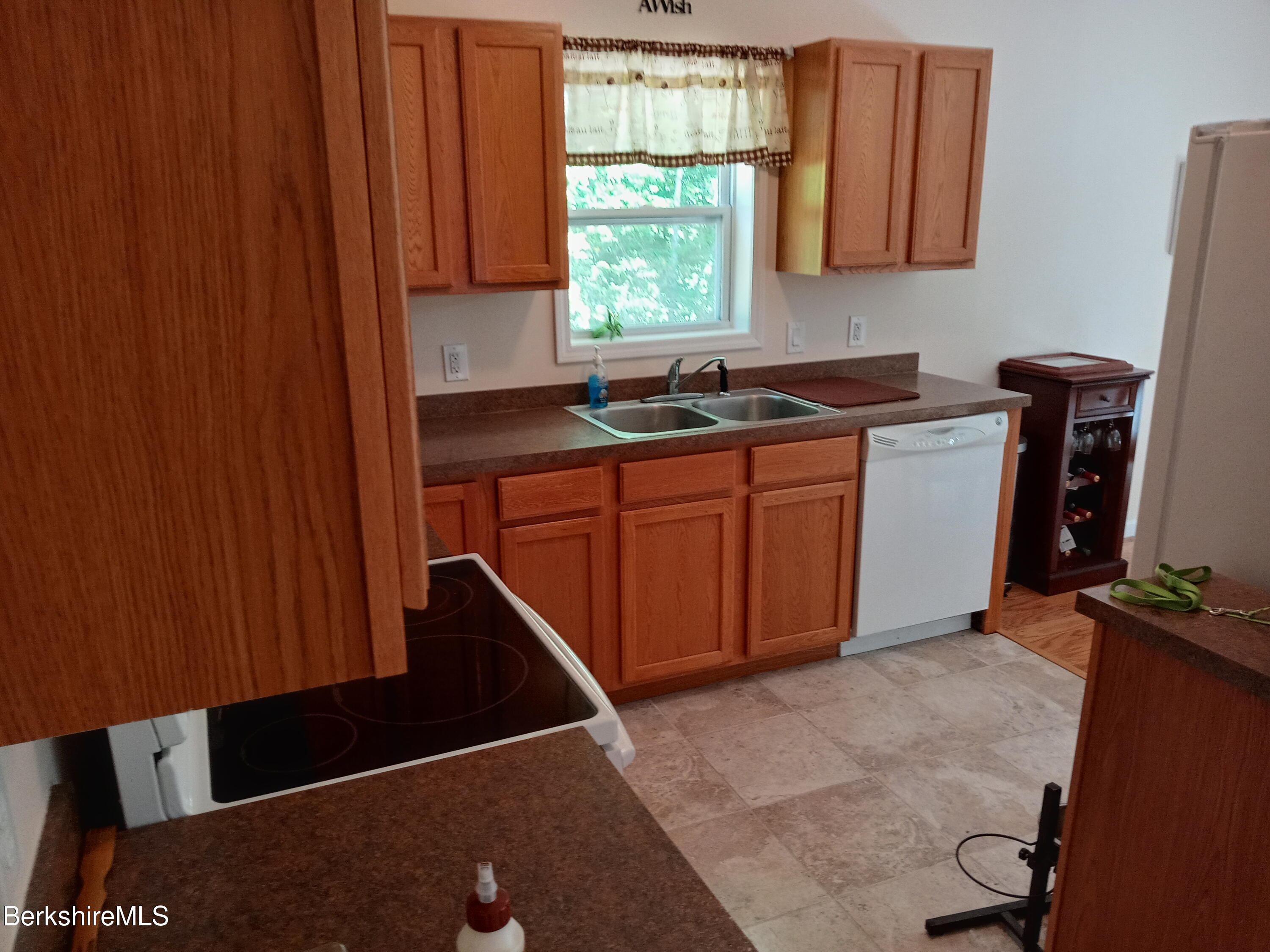 42 Norton Road Otis, MA 01029 - Photo 22 of 35 a kitchen with a window a sink and a stove top oven
