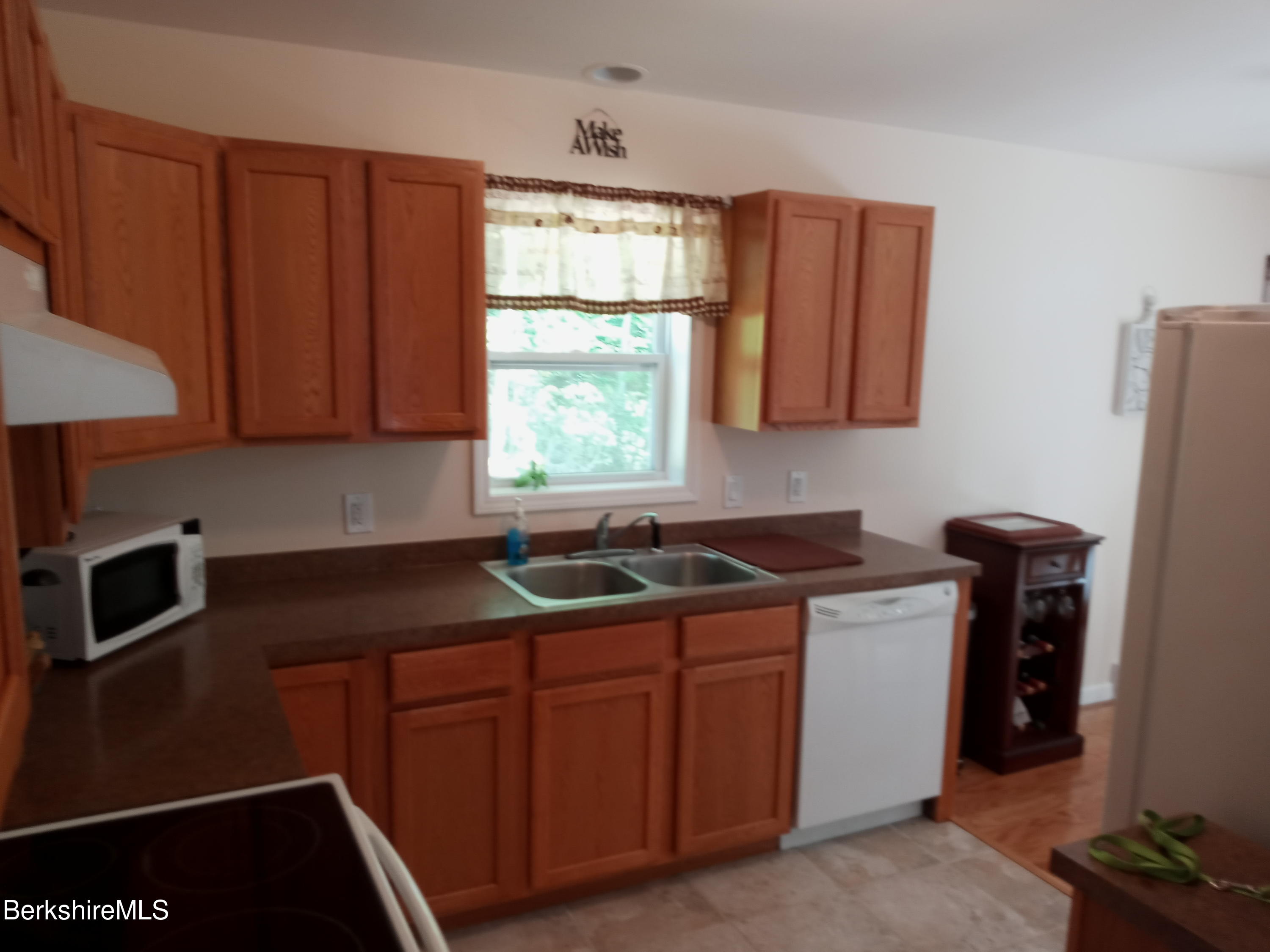 42 Norton Road Otis, MA 01029 - Photo 25 of 35 a kitchen with stainless steel appliances granite countertop a sink stove and refrigerator