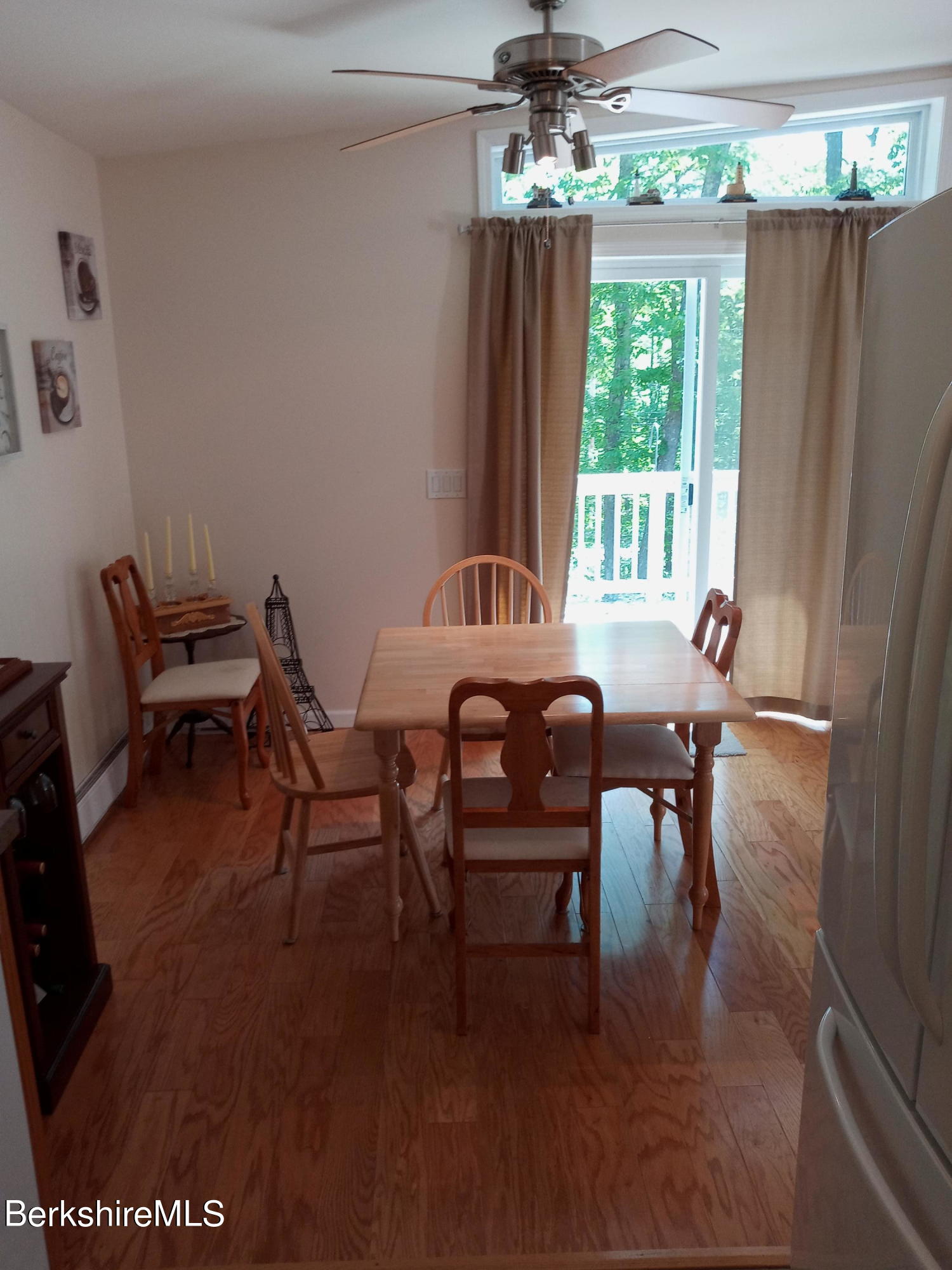 42 Norton Road Otis, MA 01029 - Photo 26 of 35 a dining room with furniture a chandelier and wooden floor