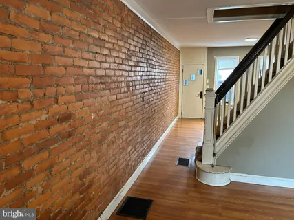 a view of entryway with wooden floor