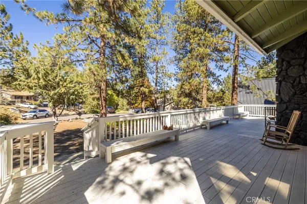 a view of a porch with wooden floor