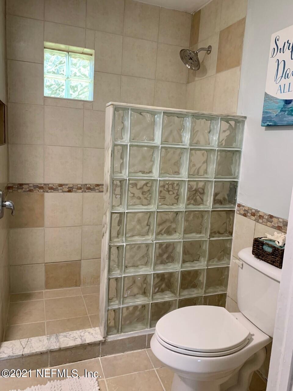 11661 Dewitt Road Jacksonville, FL 32218 - Photo 11 of 14 a bathroom with a toilet and a shower