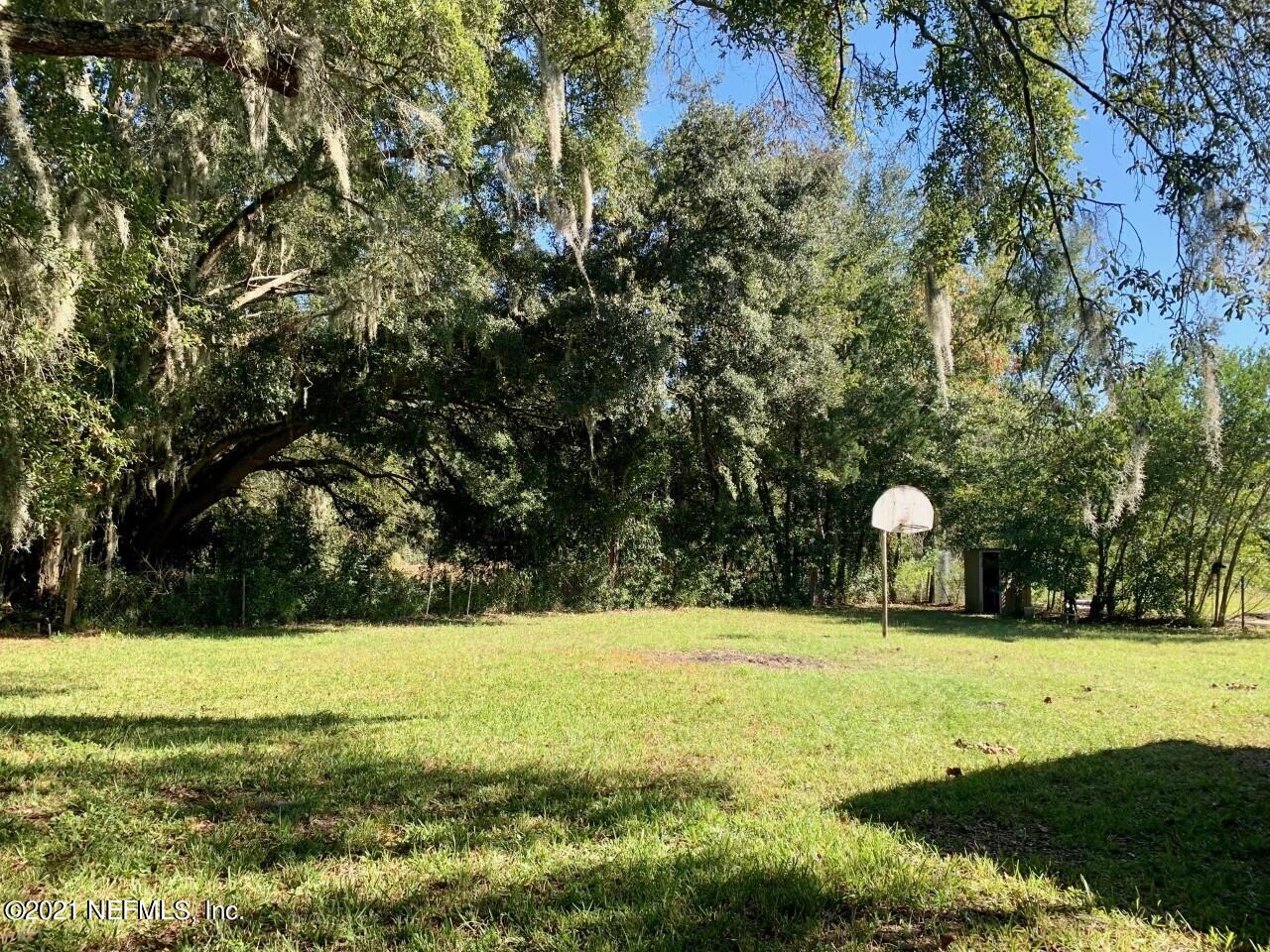 11661 Dewitt Road Jacksonville, FL 32218 - Photo 13 of 14 a view of swimming pool with a yard